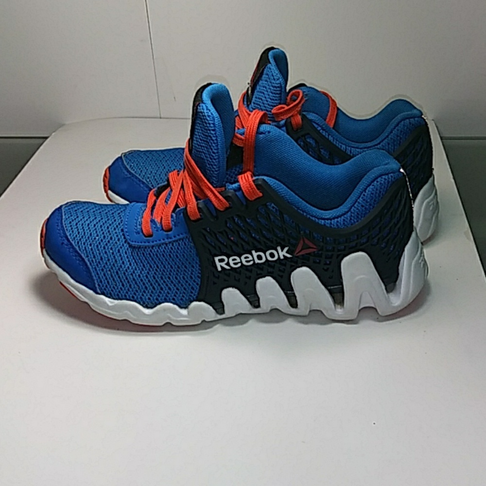 Kids blue orange and white Reebok Zigtech size 1.5